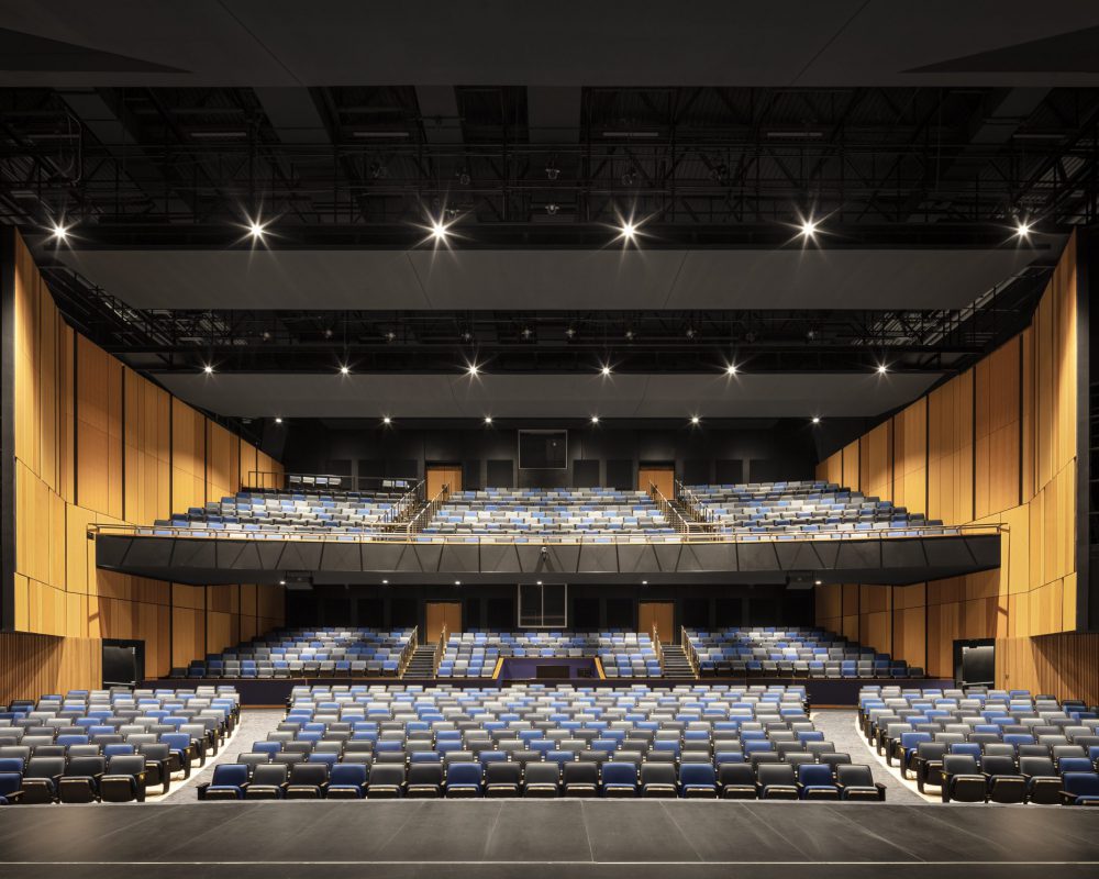 Stage vantage point featuring the floor and balcony seating of the performing arts center.